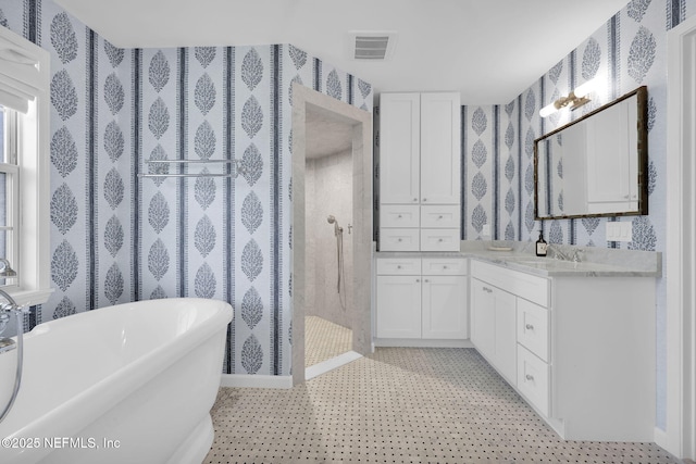101 Royal Lagoon Ct, Ponte Vedra Beach, FL 32082 - full bathroom with a freestanding tub, vanity, a tile shower, and wallpapered walls