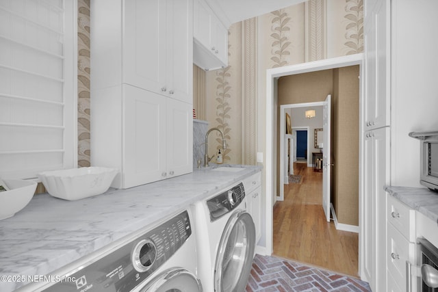 101 Royal Lagoon Ct, Ponte Vedra Beach, FL 32082 - laundry room featuring washing machine and dryer, cabinet space, wallpapered walls, and brick floors