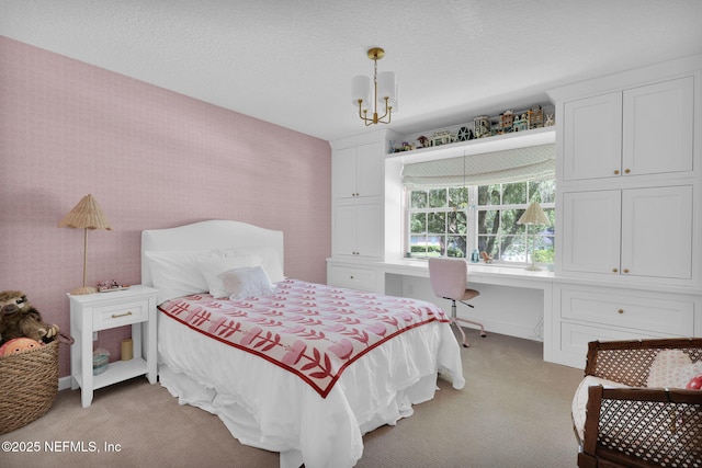 101 Royal Lagoon Ct, Ponte Vedra Beach, FL 32082 - bedroom featuring light colored carpet, built in desk, and a chandelier