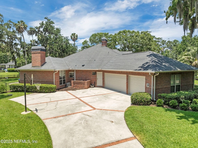 101 Royal Lagoon Ct, Ponte Vedra Beach, FL 32082 - single story home with a chimney, brick siding, an attached garage, and driveway