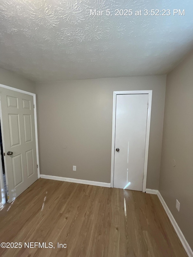 1624 36th St Unit 1-4, Jacksonville, FL 32209 - unfurnished bedroom featuring wood finished floors