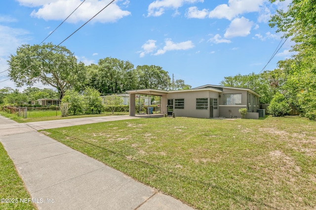7314 Hielo Dr, Jacksonville, FL 32211 - view of front facade with concrete driveway and an attached carport