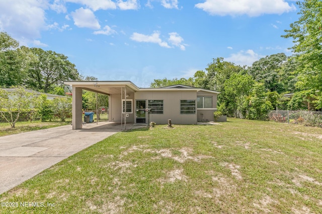 7314 Hielo Dr, Jacksonville, FL 32211 - rear view of house with a carport and concrete driveway