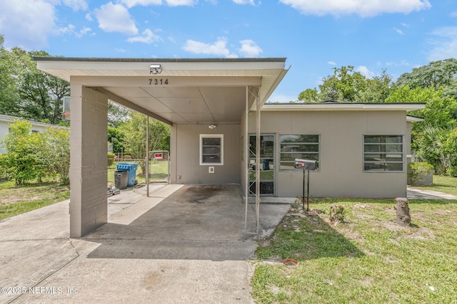 7314 Hielo Dr, Jacksonville, FL 32211 - view of front of home with a carport and concrete driveway