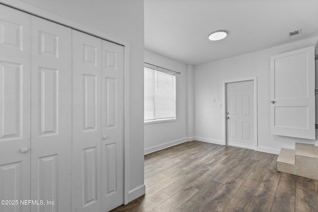 7314 Hielo Dr, Jacksonville, FL 32211 - entryway with baseboards and dark wood-style flooring