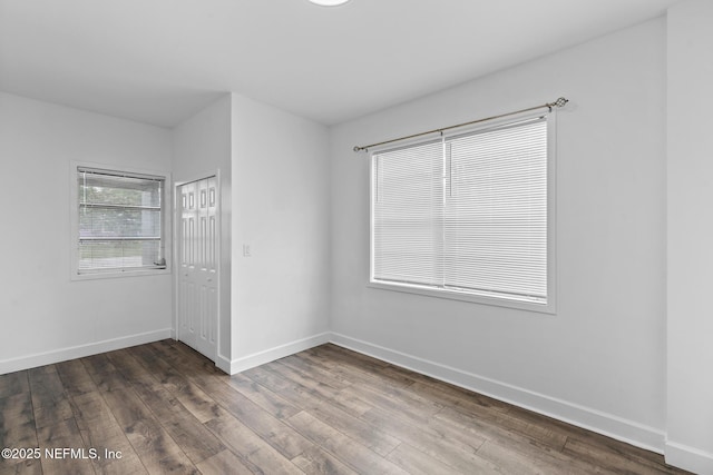 7314 Hielo Dr, Jacksonville, FL 32211 - empty room featuring dark wood-type flooring and baseboards