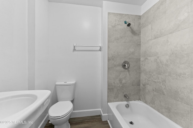7314 Hielo Dr, Jacksonville, FL 32211 - bathroom with wood finished floors and bathtub / shower combination