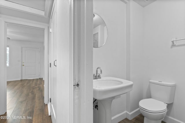 7314 Hielo Dr, Jacksonville, FL 32211 - half bath with wood finished floors and toilet