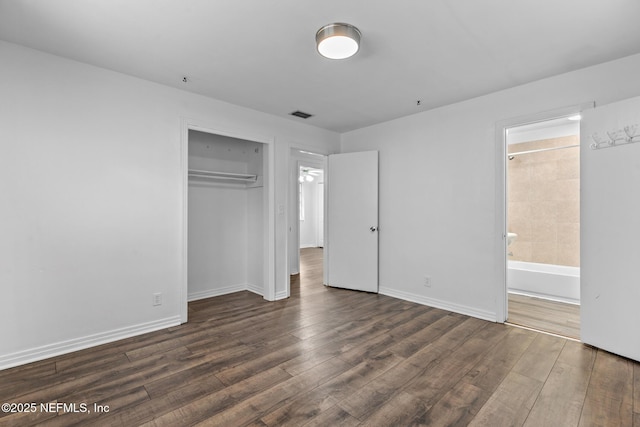 7314 Hielo Dr, Jacksonville, FL 32211 - unfurnished bedroom featuring wood finished floors, a closet, and ensuite bath