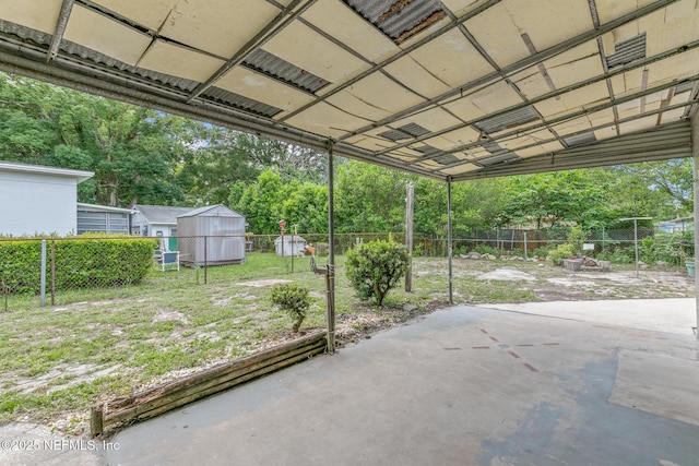 7314 Hielo Dr, Jacksonville, FL 32211 - fenced backyard with a patio, a shed, and view of scattered trees