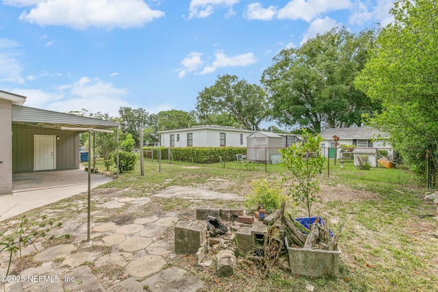 7314 Hielo Dr, Jacksonville, FL 32211 - view of yard with a carport and concrete driveway