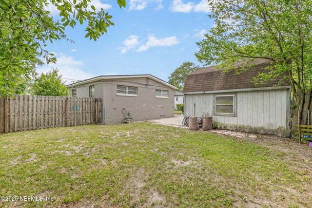 7314 Hielo Dr, Jacksonville, FL 32211 - back of property with roof with shingles and a patio