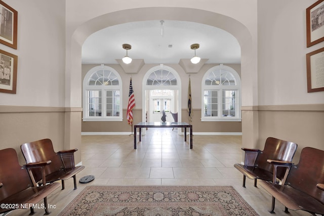 2525 College St Unit 1305, Jacksonville, FL 32204 - recreation room with arched walkways, healthy amount of natural light, and light tile patterned flooring