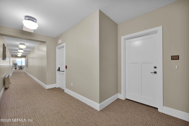 2525 College St Unit 1305, Jacksonville, FL 32204 - hallway with carpet, radiator heating unit, and a textured ceiling