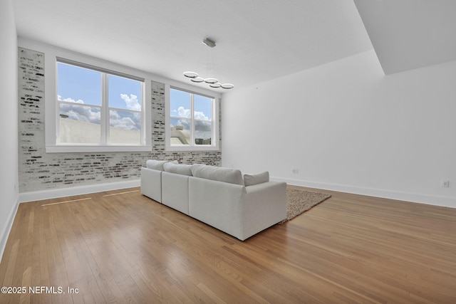 2525 College St Unit 1305, Jacksonville, FL 32204 - living room featuring wood-type flooring and a chandelier