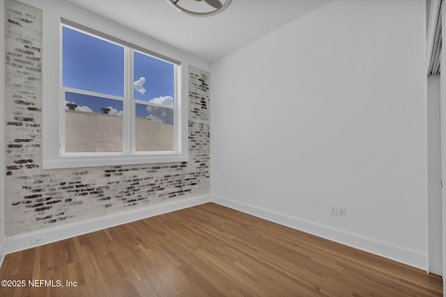 2525 College St Unit 1305, Jacksonville, FL 32204 - spare room with wood finished floors and healthy amount of natural light