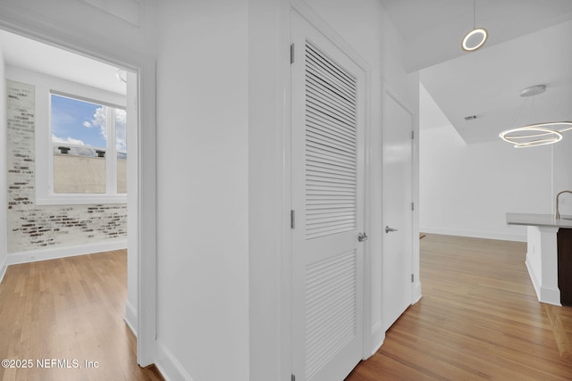 2525 College St Unit 1305, Jacksonville, FL 32204 - hall with light wood finished floors and baseboards