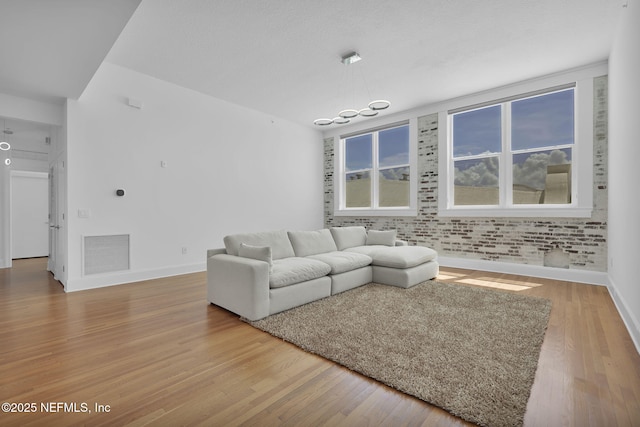 2525 College St Unit 1305, Jacksonville, FL 32204 - living room with light wood-style flooring