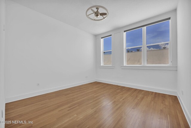 2525 College St Unit 1305, Jacksonville, FL 32204 - empty room with hardwood / wood-style flooring and baseboards