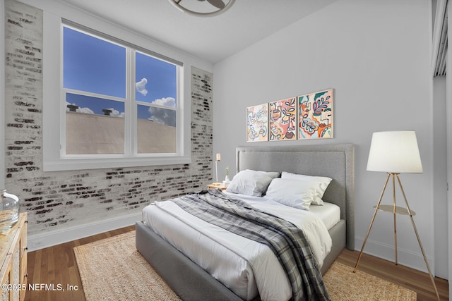 2525 College St Unit 1305, Jacksonville, FL 32204 - bedroom featuring baseboards and wood finished floors