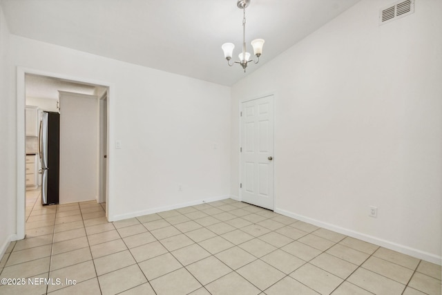 423 S Blvd, Macclenny, FL 32063 - spare room with a chandelier, lofted ceiling, and light tile patterned flooring