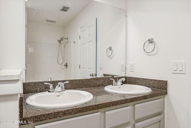 423 S Blvd, Macclenny, FL 32063 - bathroom with double vanity and a shower