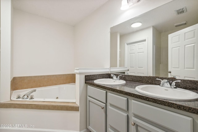 423 S Blvd, Macclenny, FL 32063 - bathroom featuring double vanity and a whirlpool tub