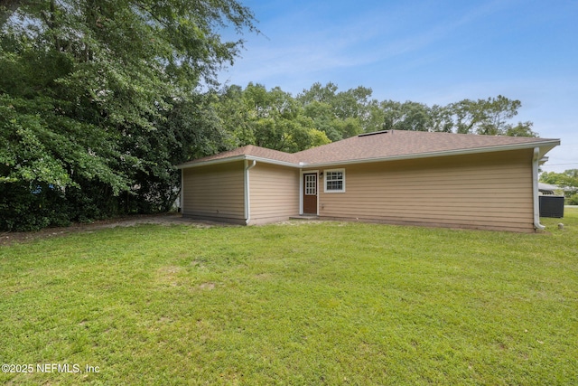 423 S Blvd, Macclenny, FL 32063 - back of house featuring a yard