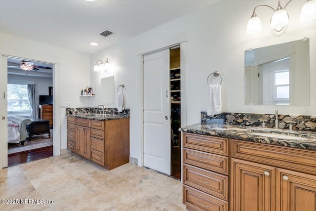 3776 Arrowhead Dr, Saint Augustine, FL 32086 - full bath featuring two vanities, ensuite bath, and ceiling fan