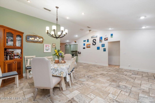 3776 Arrowhead Dr, Saint Augustine, FL 32086 - dining room featuring a chandelier, lofted ceiling, light stone finish floors, and recessed lighting