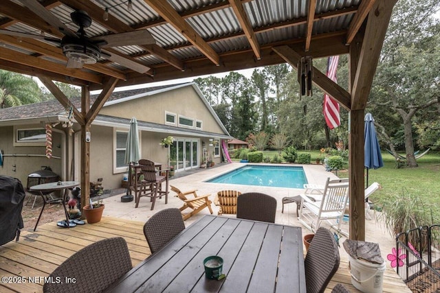 3776 Arrowhead Dr, Saint Augustine, FL 32086 - outdoor pool featuring outdoor dining space, ceiling fan, a deck, and a patio area