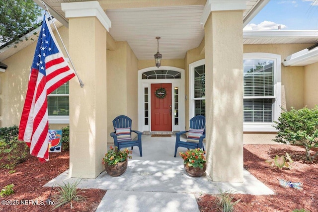 573 N Bridgestone Ave, Saint Johns, FL 32259 - view of exterior entry with covered porch and stucco siding