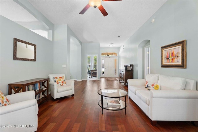 573 N Bridgestone Ave, Saint Johns, FL 32259 - living room featuring a ceiling fan, wood finished floors, arched walkways, and a textured ceiling
