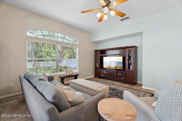573 N Bridgestone Ave, Saint Johns, FL 32259 - living room with plenty of natural light, ceiling fan, and a textured ceiling