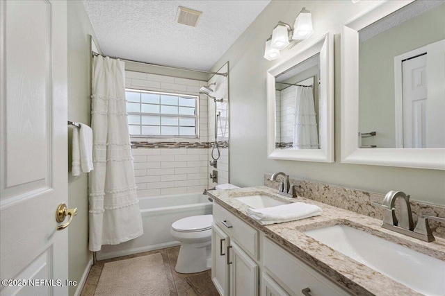 573 N Bridgestone Ave, Saint Johns, FL 32259 - full bath with double vanity, shower / bath combo, a textured ceiling, and tile patterned flooring