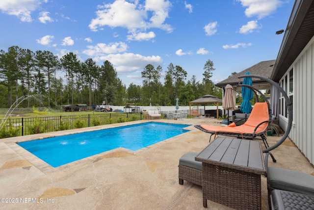 36501 Shortleaf Ave, Hilliard, FL 32046 - view of pool featuring a gazebo, a patio, a fenced backyard, and view of wooded area