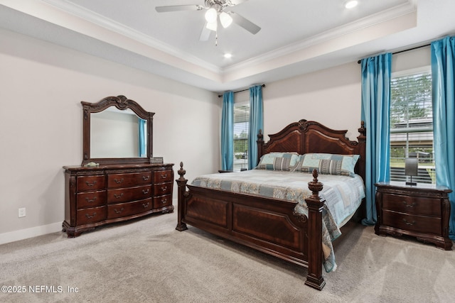 36501 Shortleaf Ave, Hilliard, FL 32046 - bedroom with a tray ceiling, multiple windows, ornamental molding, light carpet, and ceiling fan