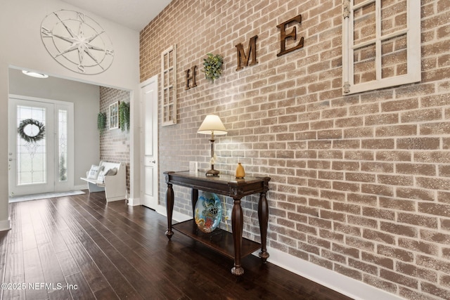 36501 Shortleaf Ave, Hilliard, FL 32046 - entryway featuring brick wall, dark wood finished floors, and a high ceiling
