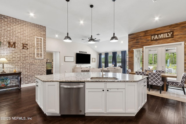 36501 Shortleaf Ave, Hilliard, FL 32046 - kitchen with stainless steel dishwasher, brick wall, dark wood finished floors, ceiling fan, and white cabinetry