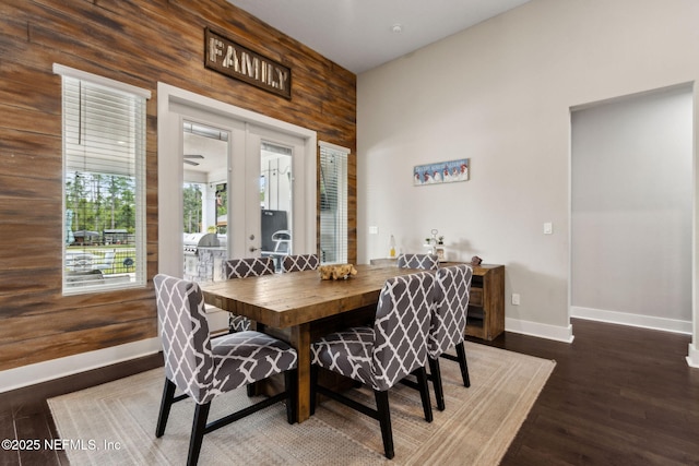 36501 Shortleaf Ave, Hilliard, FL 32046 - dining area with wood walls, french doors, and wood finished floors