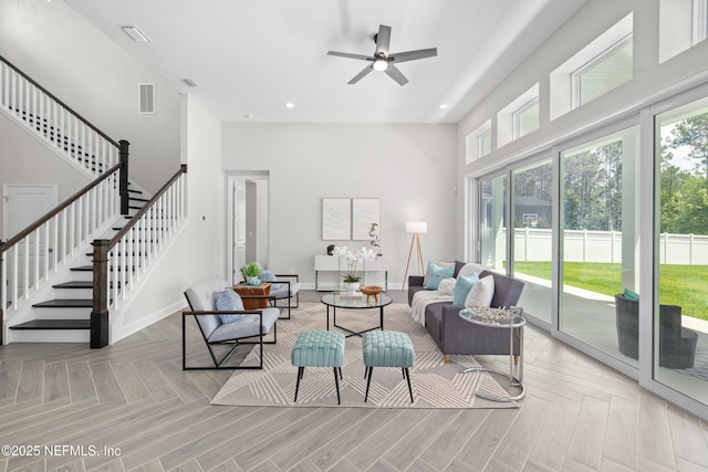 238 Courtney Chase Dr, Saint Augustine, FL 32092 - living room with a towering ceiling, plenty of natural light, stairway, a ceiling fan, and recessed lighting