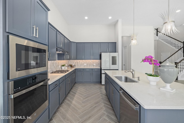 238 Courtney Chase Dr, Saint Augustine, FL 32092 - kitchen featuring stainless steel appliances, light countertops, backsplash, under cabinet range hood, and recessed lighting