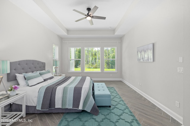 238 Courtney Chase Dr, Saint Augustine, FL 32092 - bedroom featuring a tray ceiling, wood finished floors, and ceiling fan