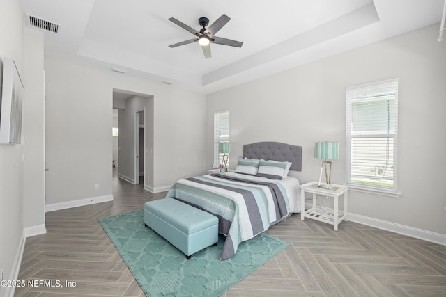 238 Courtney Chase Dr, Saint Augustine, FL 32092 - bedroom with a raised ceiling, multiple windows, and a ceiling fan