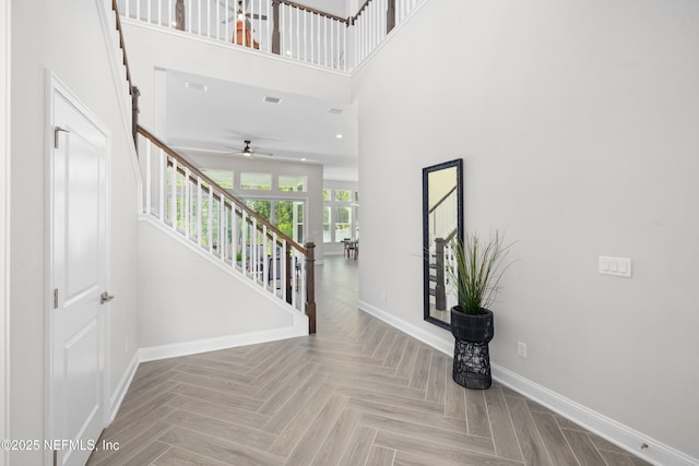238 Courtney Chase Dr, Saint Augustine, FL 32092 - foyer entrance featuring stairway, ceiling fan, and a high ceiling