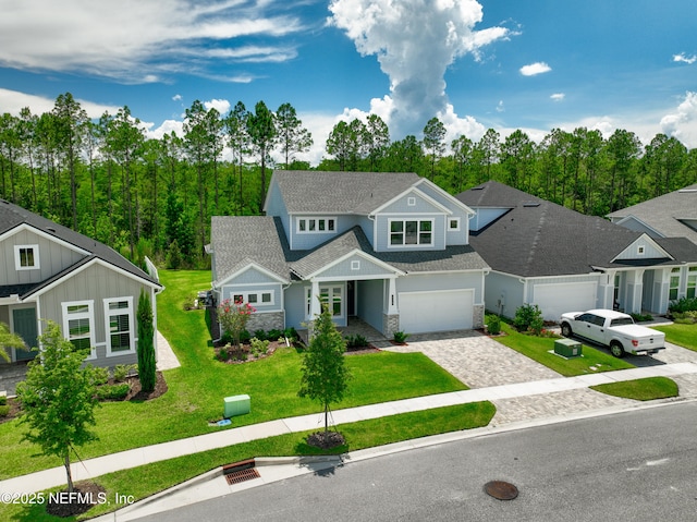 238 Courtney Chase Dr, Saint Augustine, FL 32092 - view of front of home with a garage, stone siding, decorative driveway, and a front yard