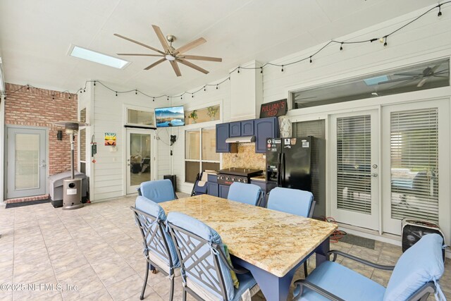1288 Creek Bend Rd, Saint Johns, FL 32259 - dining room featuring ceiling fan and a skylight
