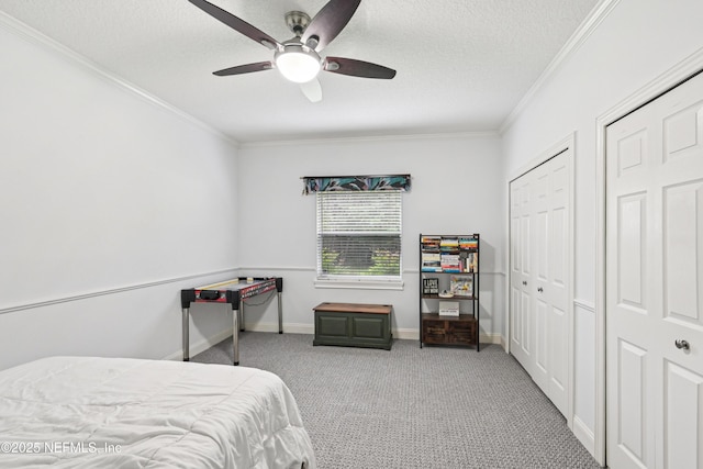 1288 Creek Bend Rd, Saint Johns, FL 32259 - carpeted bedroom featuring crown molding, two closets, a textured ceiling, and a ceiling fan