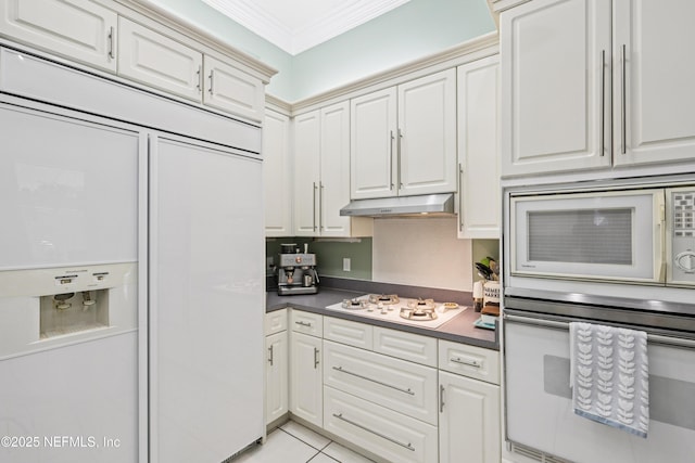 1288 Creek Bend Rd, Saint Johns, FL 32259 - kitchen with white appliances, crown molding, under cabinet range hood, white cabinetry, and dark countertops
