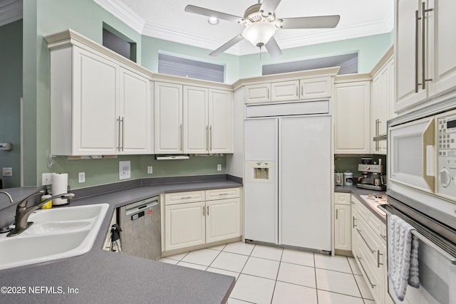 1288 Creek Bend Rd, Saint Johns, FL 32259 - kitchen featuring stainless steel appliances, crown molding, ceiling fan, dark countertops, and light tile patterned floors